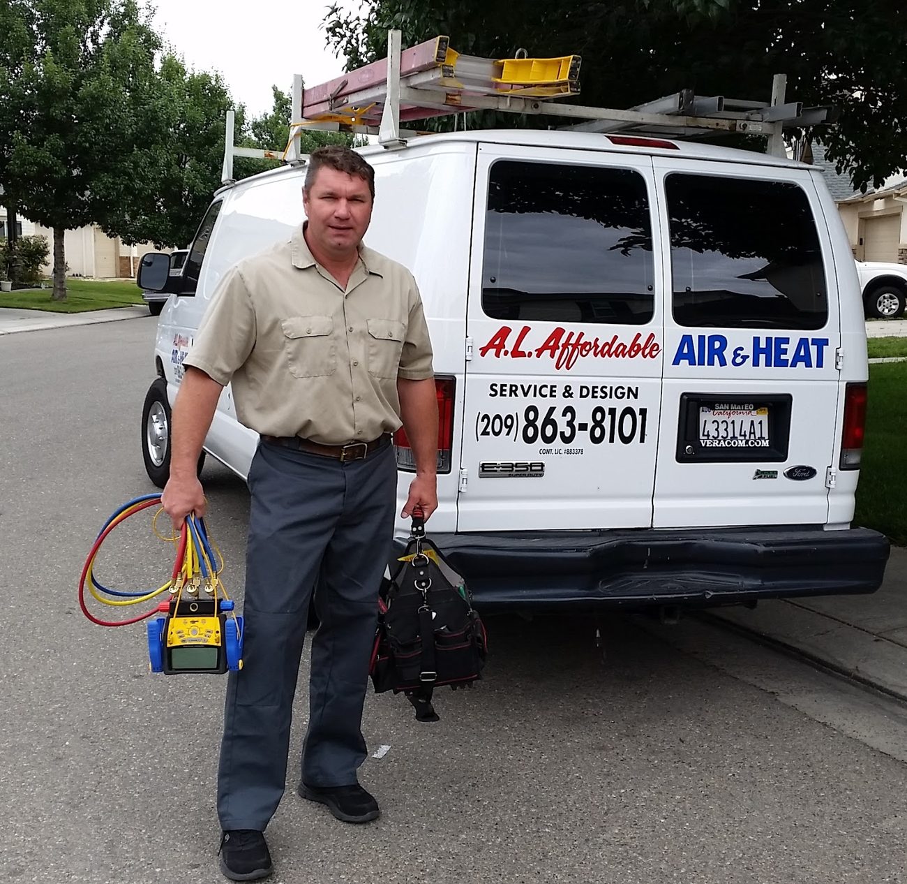 A L Affordable Air & Heat technician with the company service van in Modesto, CA